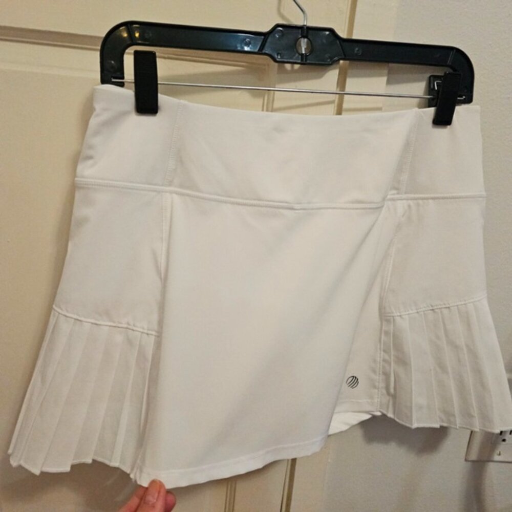 Tennis Skirt White with Pleats and Inner Shorts with a Pocket. Size small.